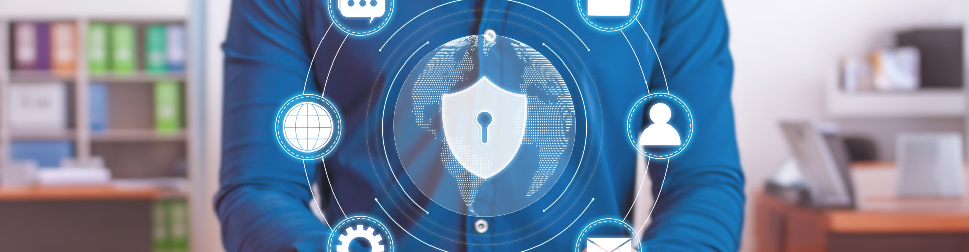 A person in a blue shirt interacts with digital security icons and a globe, emphasizing cybersecurity and data protection.